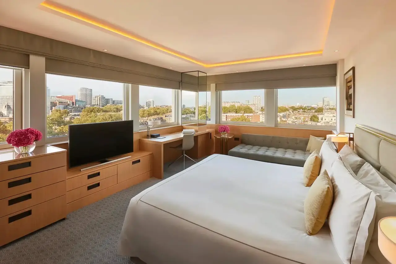 Junior Suite with separate sitting area and warm lighting